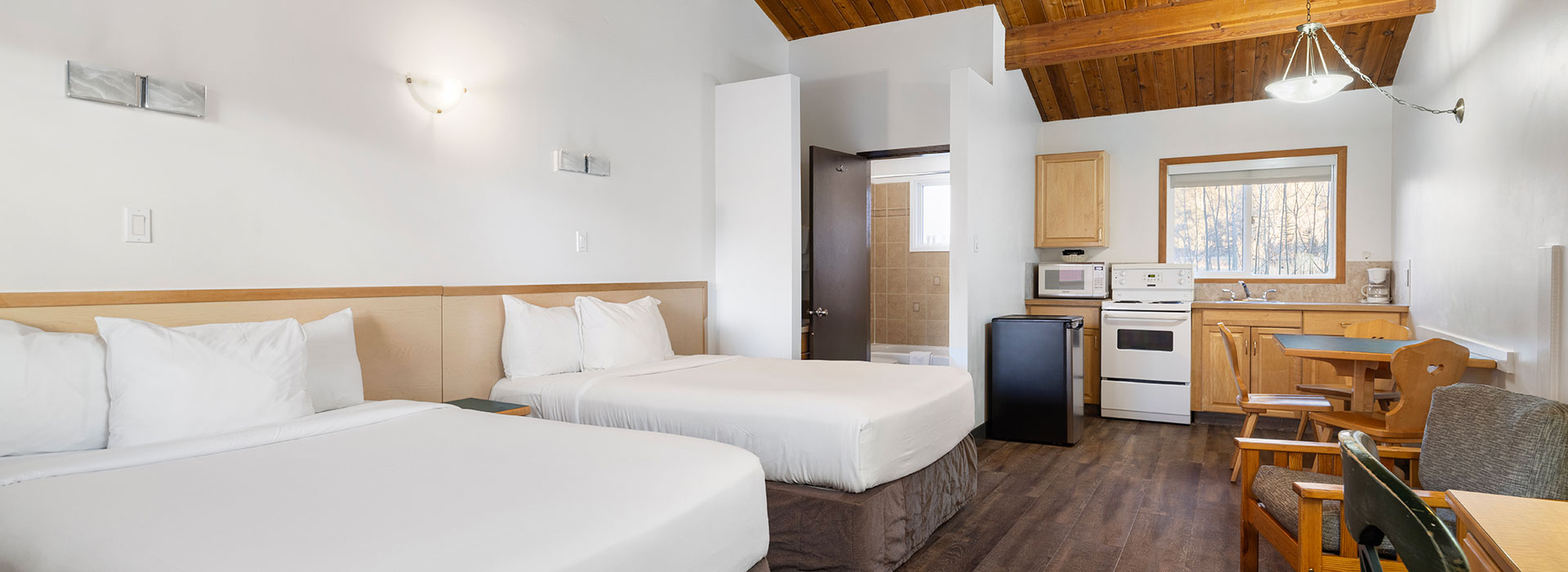 Hotel room with kitchen and two queen beds