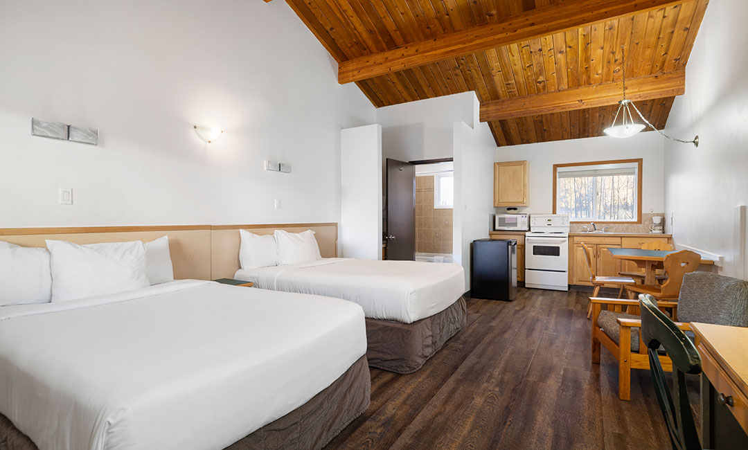Hotel room with kitchen and two queen beds